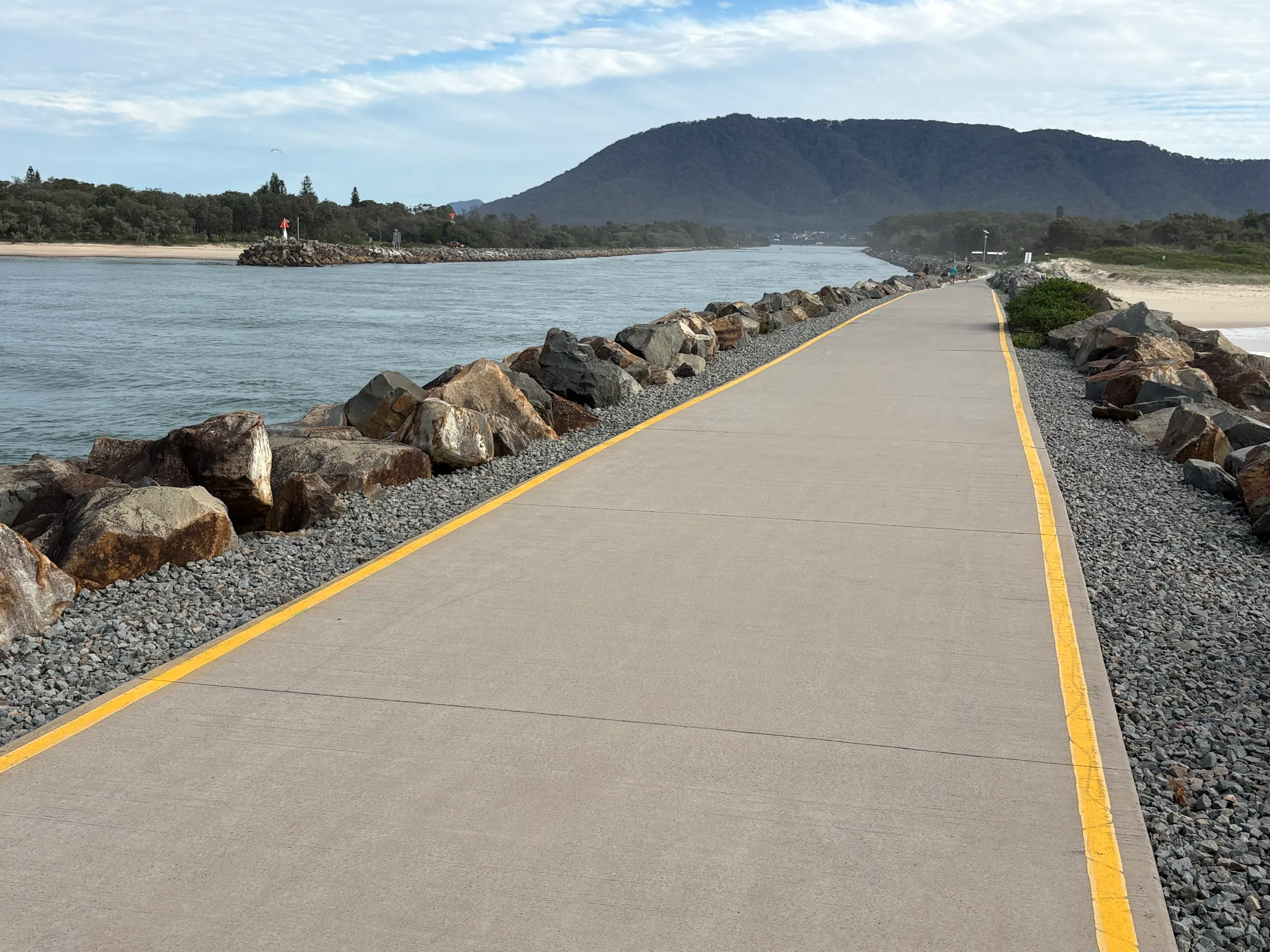 A sealed path running out along the breakwall toward the river mouth at North Haven