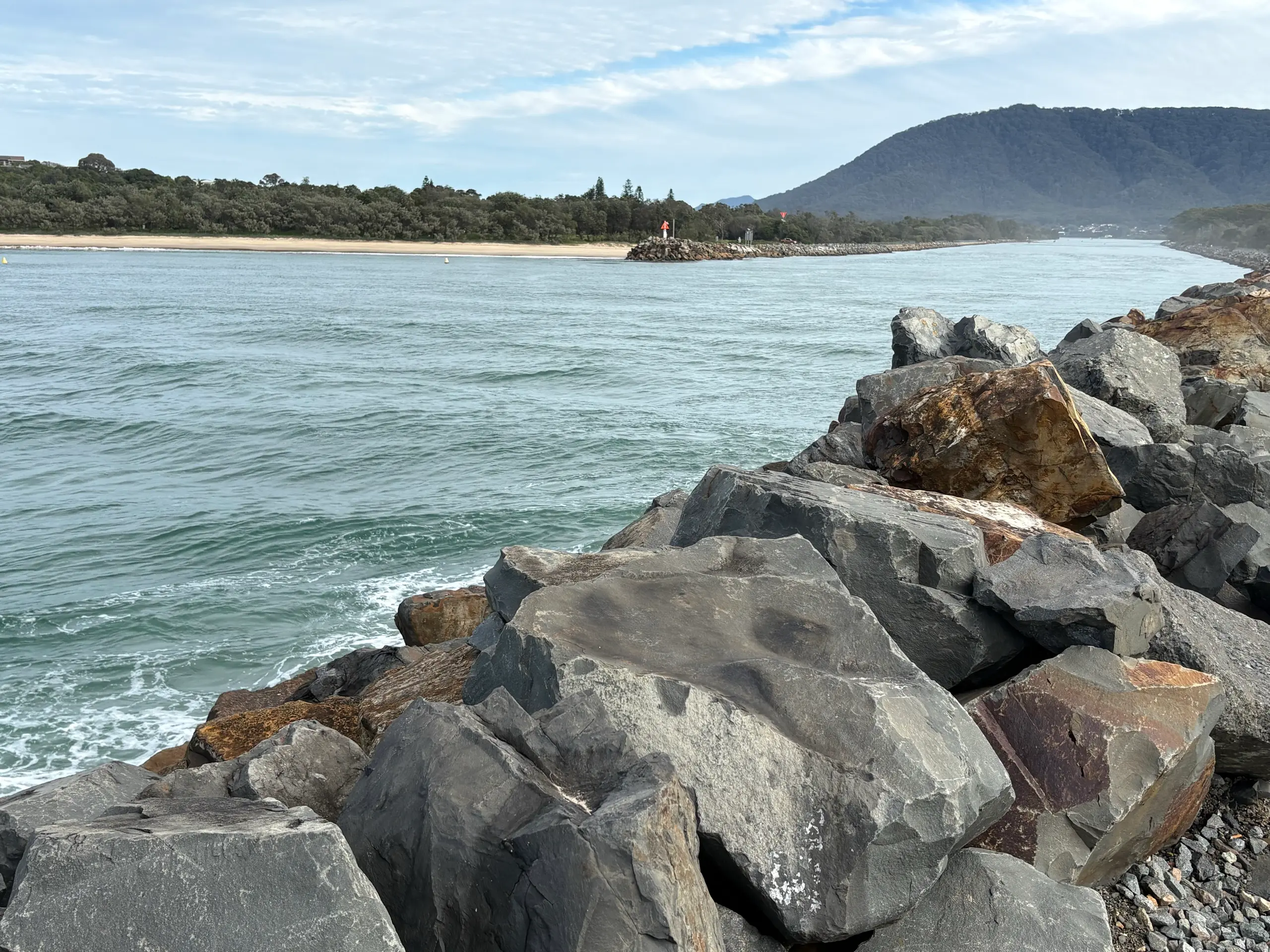 The rock breakwall at the Camden Haven River entrance at North Haven