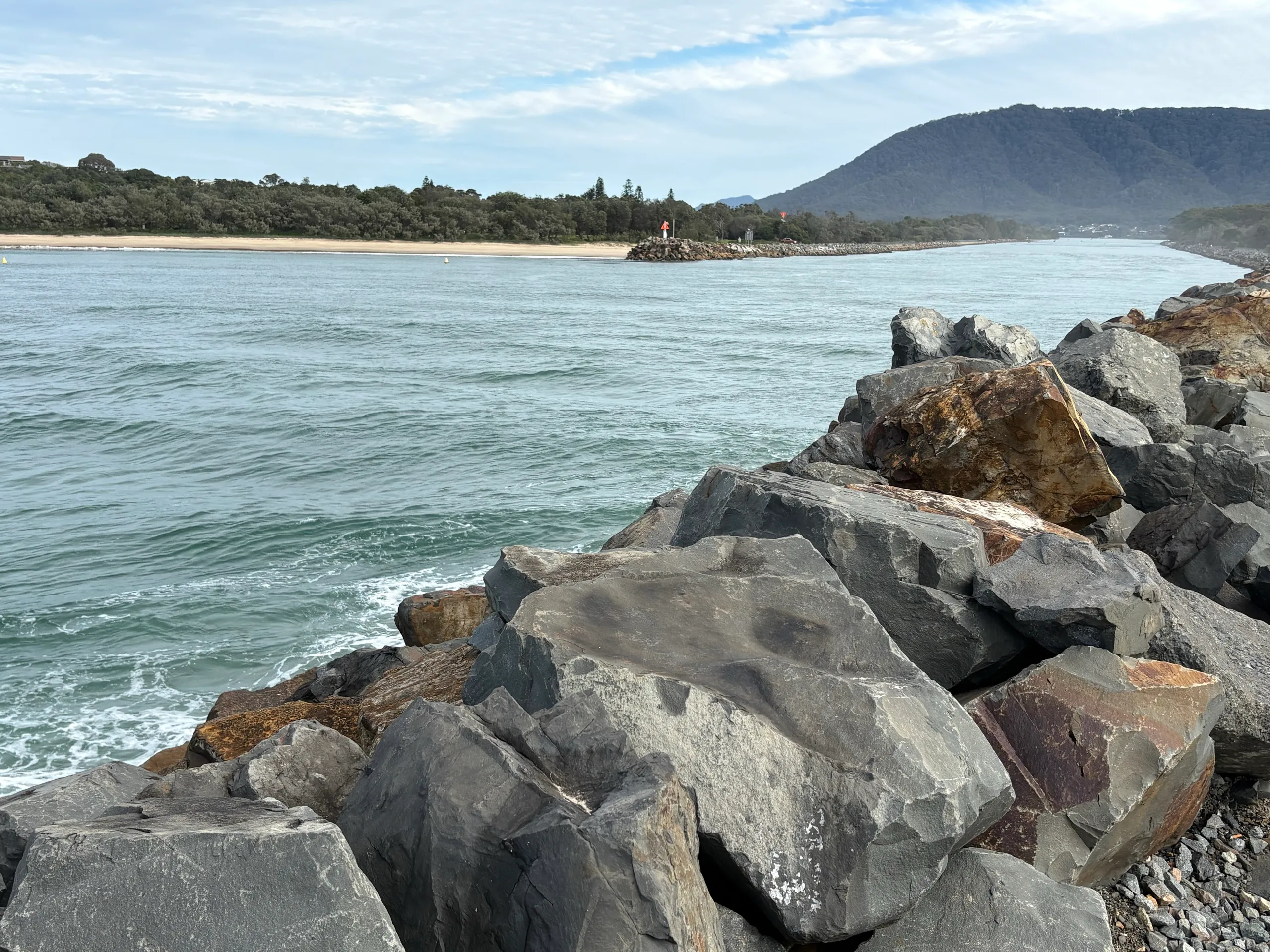 The rock breakwall at the Camden Haven River entrance at North Haven