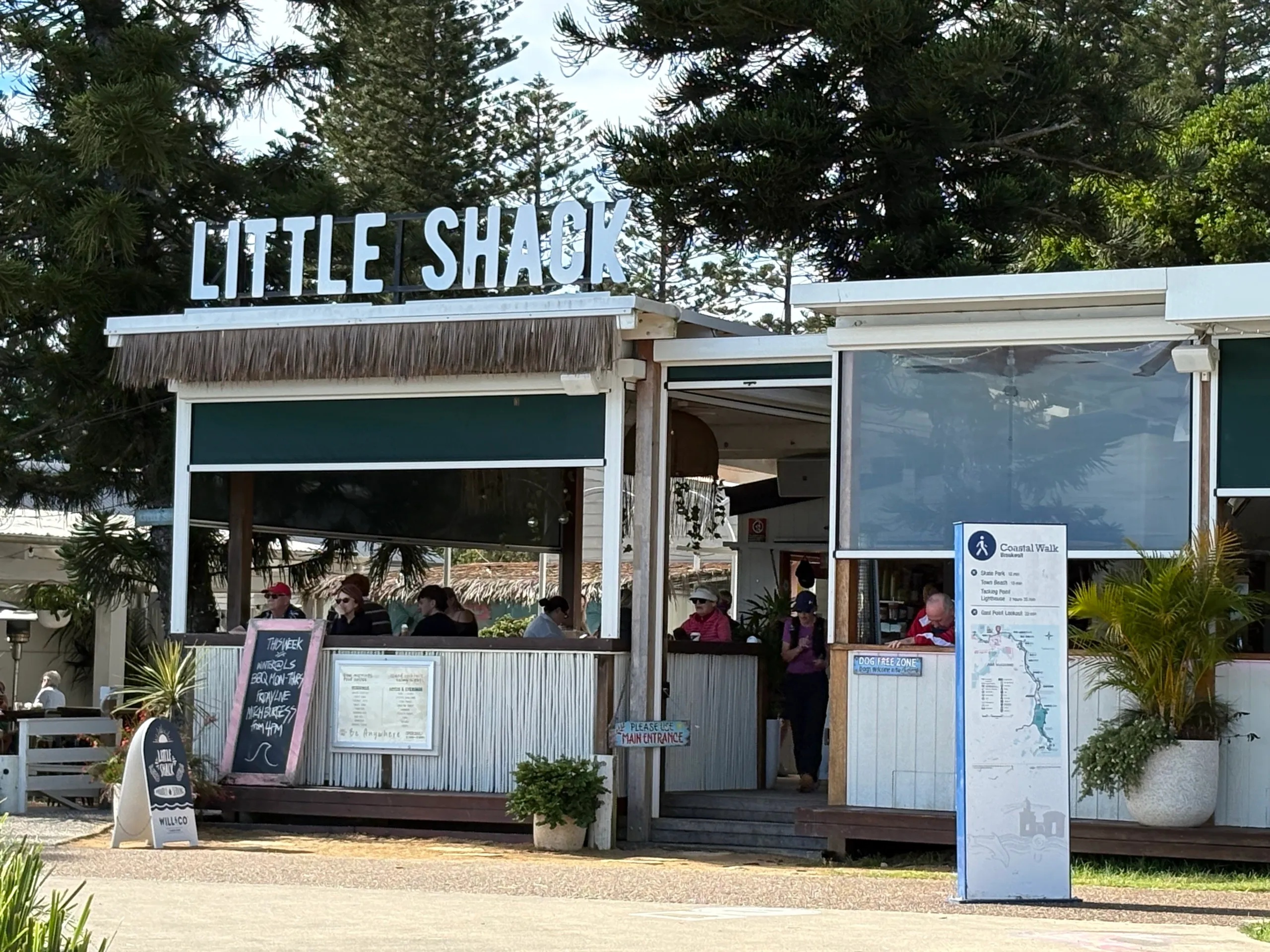 The Little Shack kiosk and a Coastal Walk sign at Town Beach, Port Macquarie