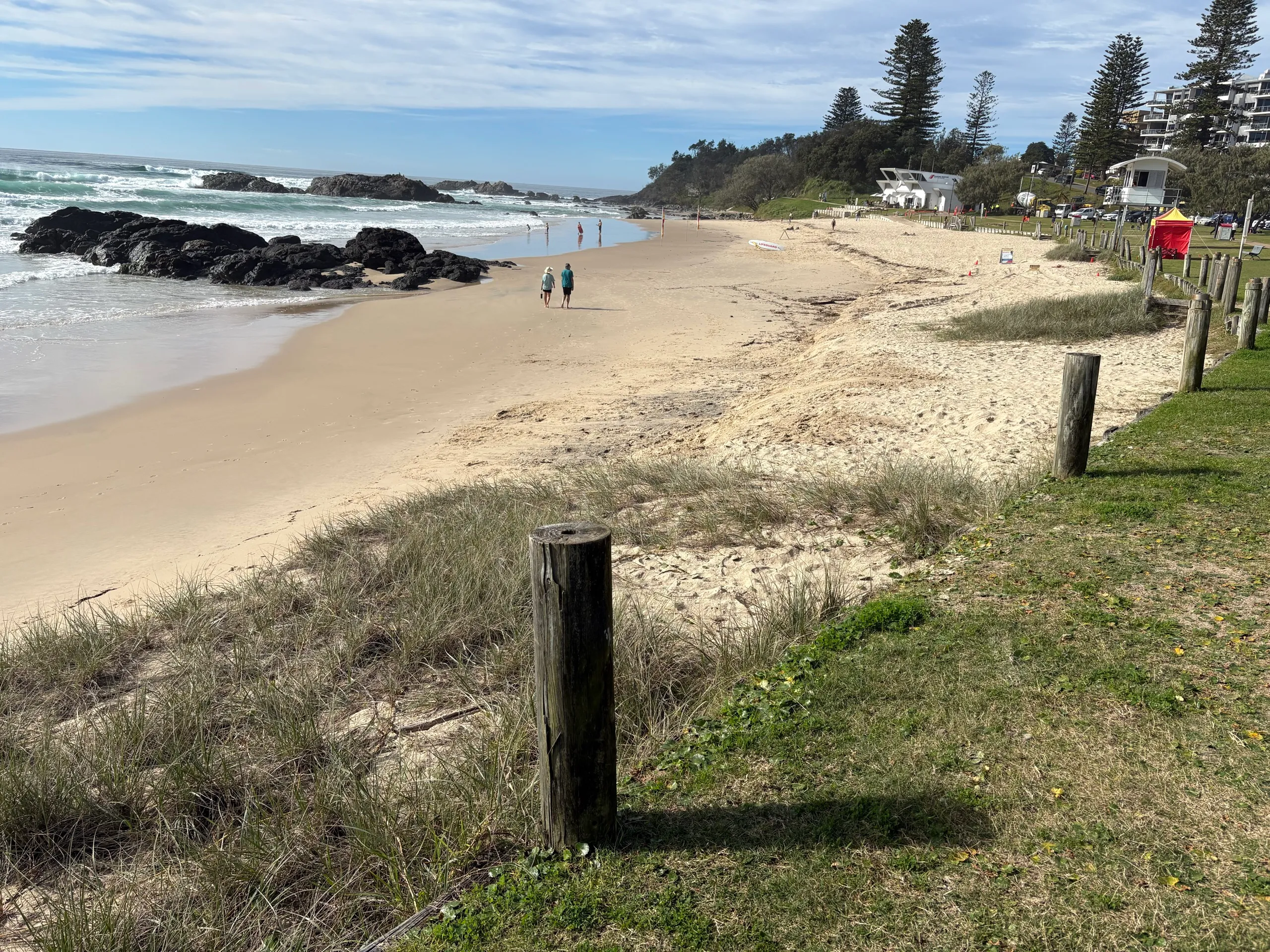 A patrolled surf beach with a lifeguard tower near town in Port Macquarie