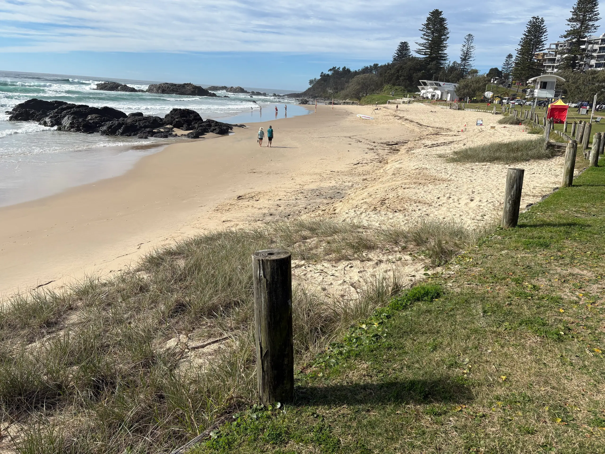 A patrolled surf beach with a lifeguard tower near town in Port Macquarie