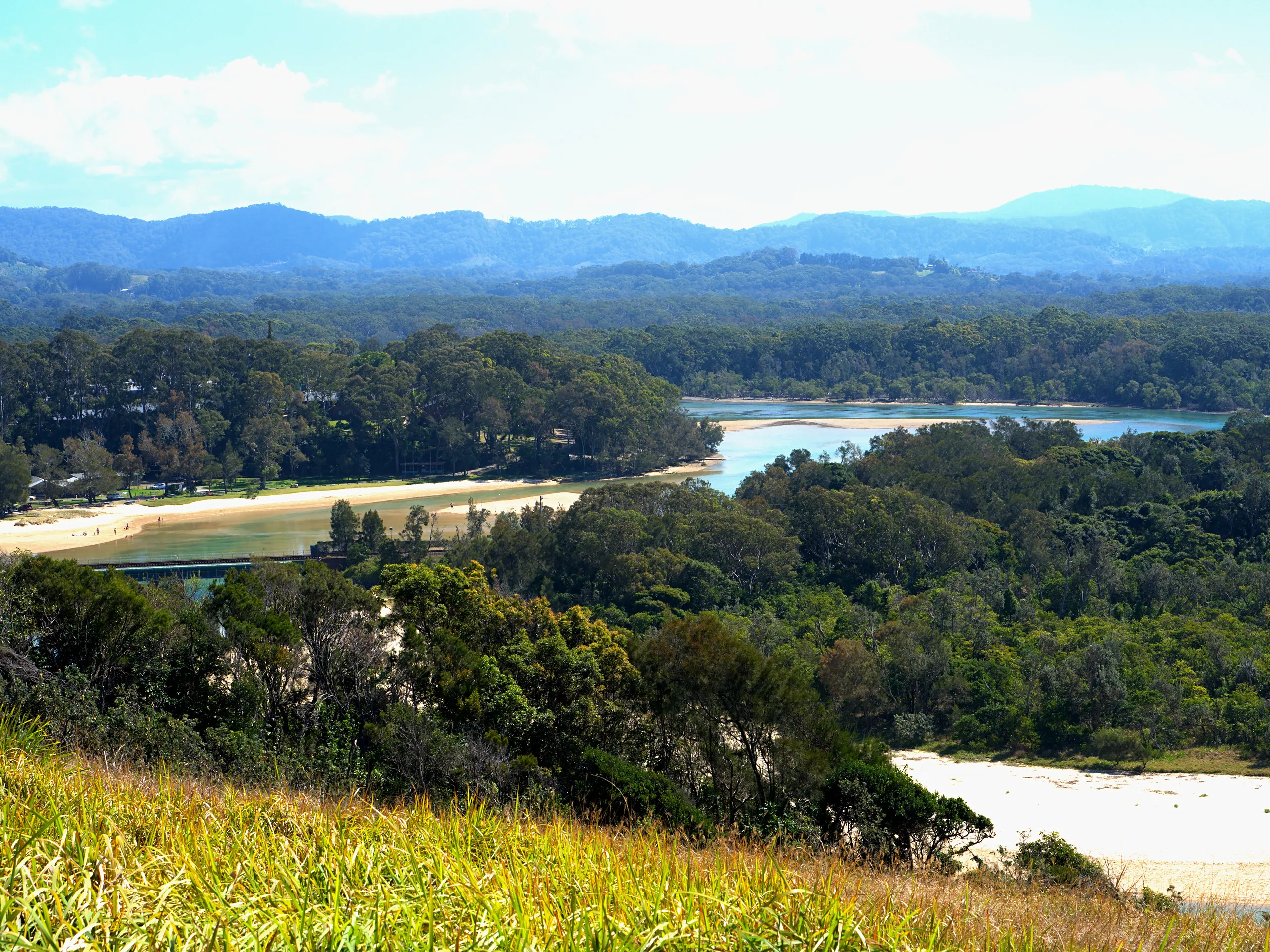 Boambee Creek winding inland through forest toward the hills behind Sawtell