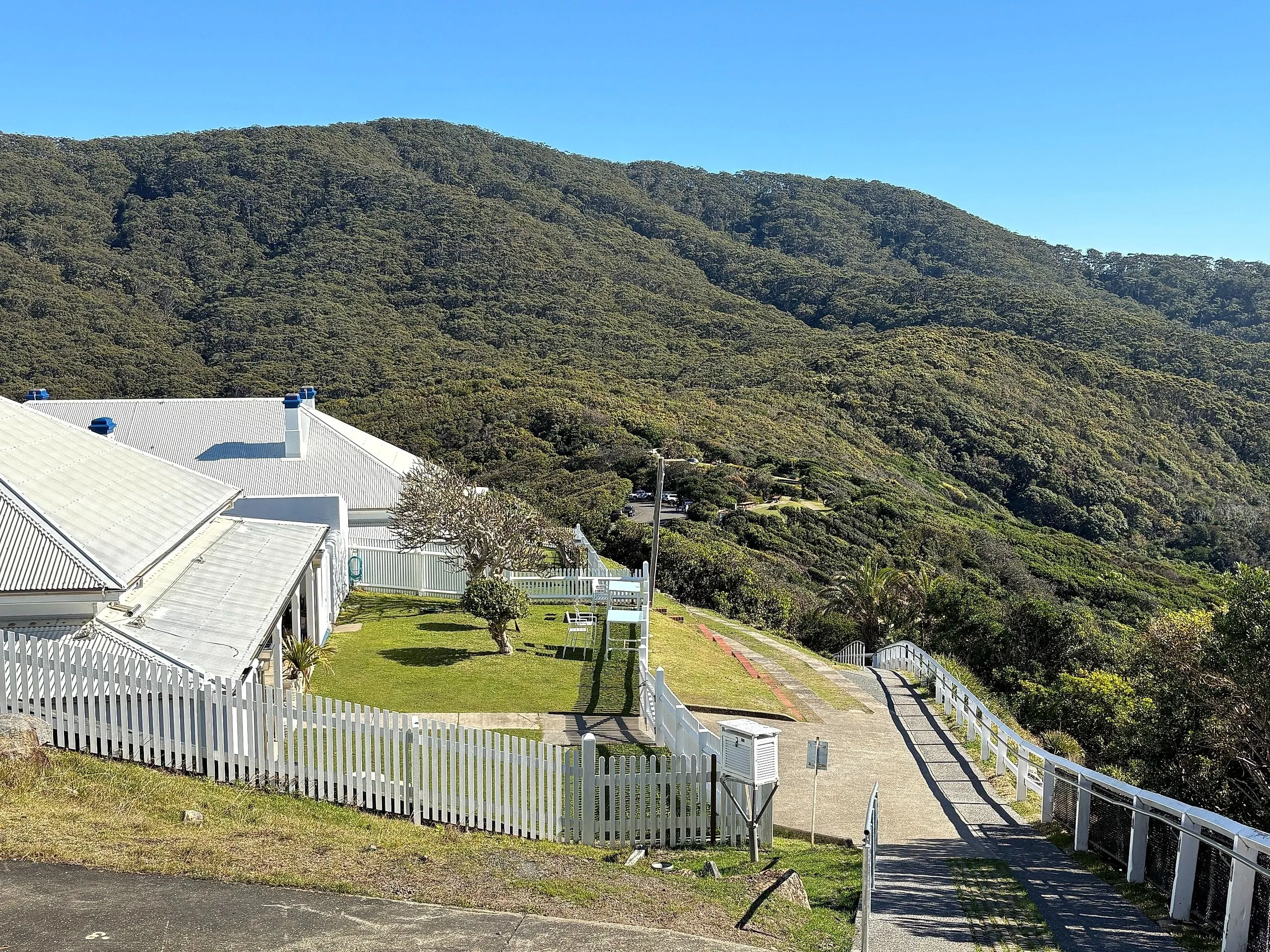 Looking down on a keepers' cottage and the walkway at Smoky Cape