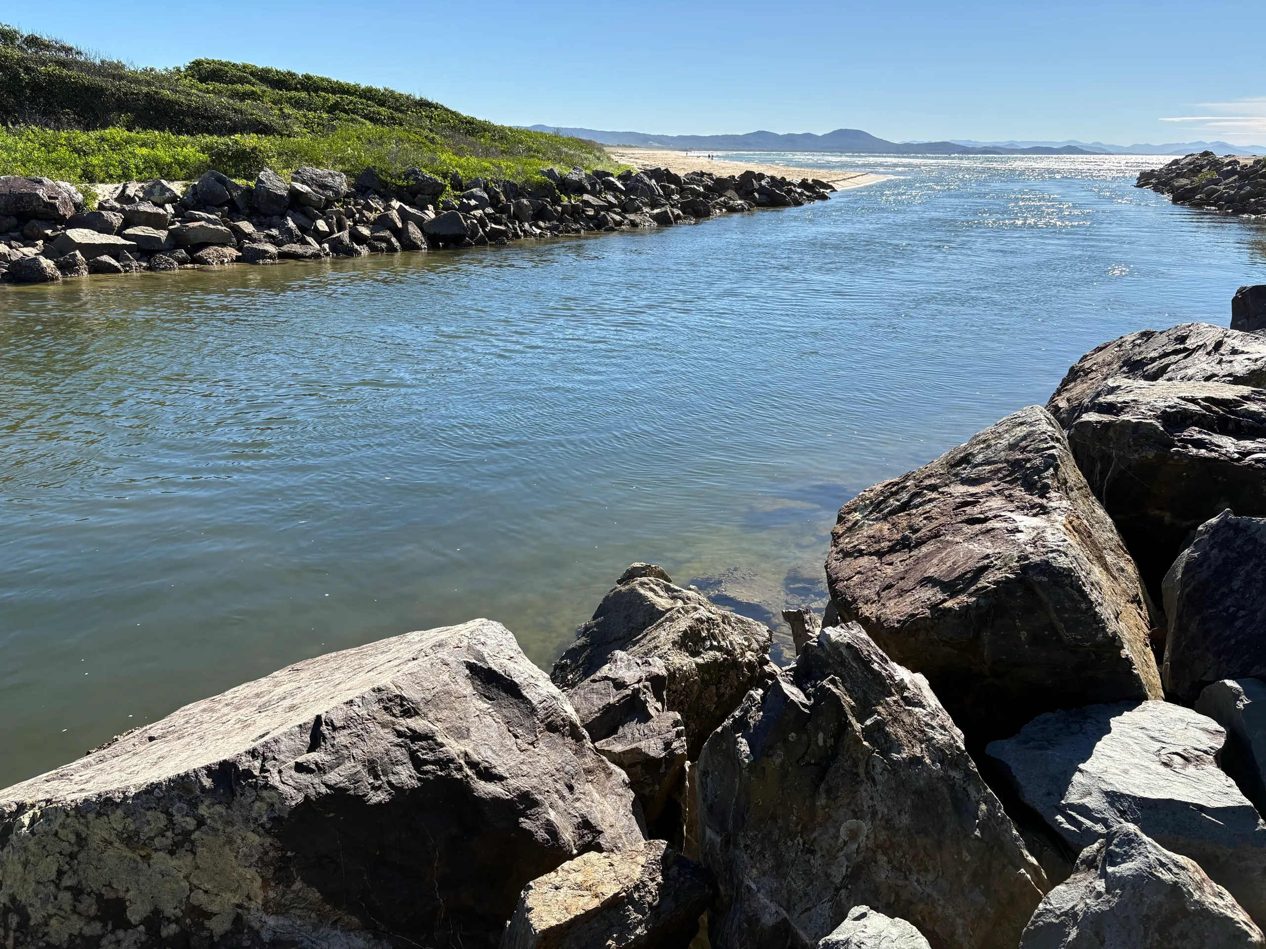 Rock breakwall channel running out to the beach at South West Rocks